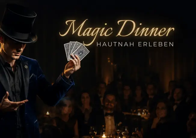 Magician holding playing cards in front of an audience during the Magic Dinner Show at Van der Valk Hotel Hildesheim