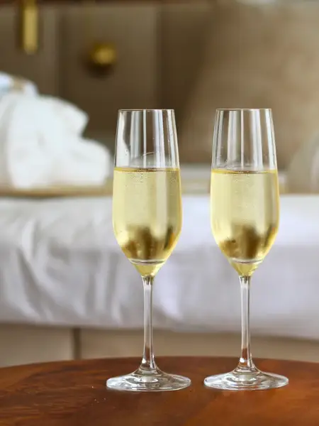 Glass of cava in hotel room