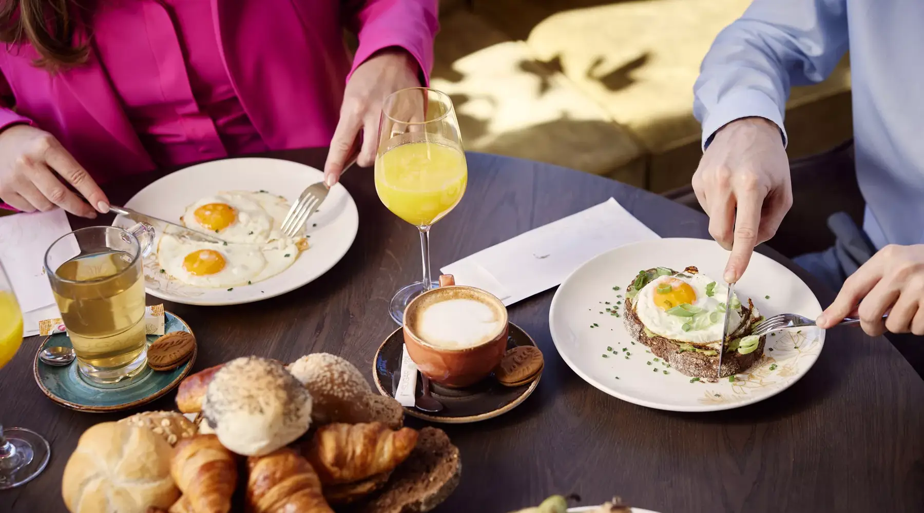 Two guys having breakfast.