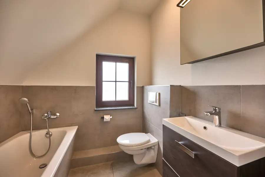 Upstairs bathroom with bathtub