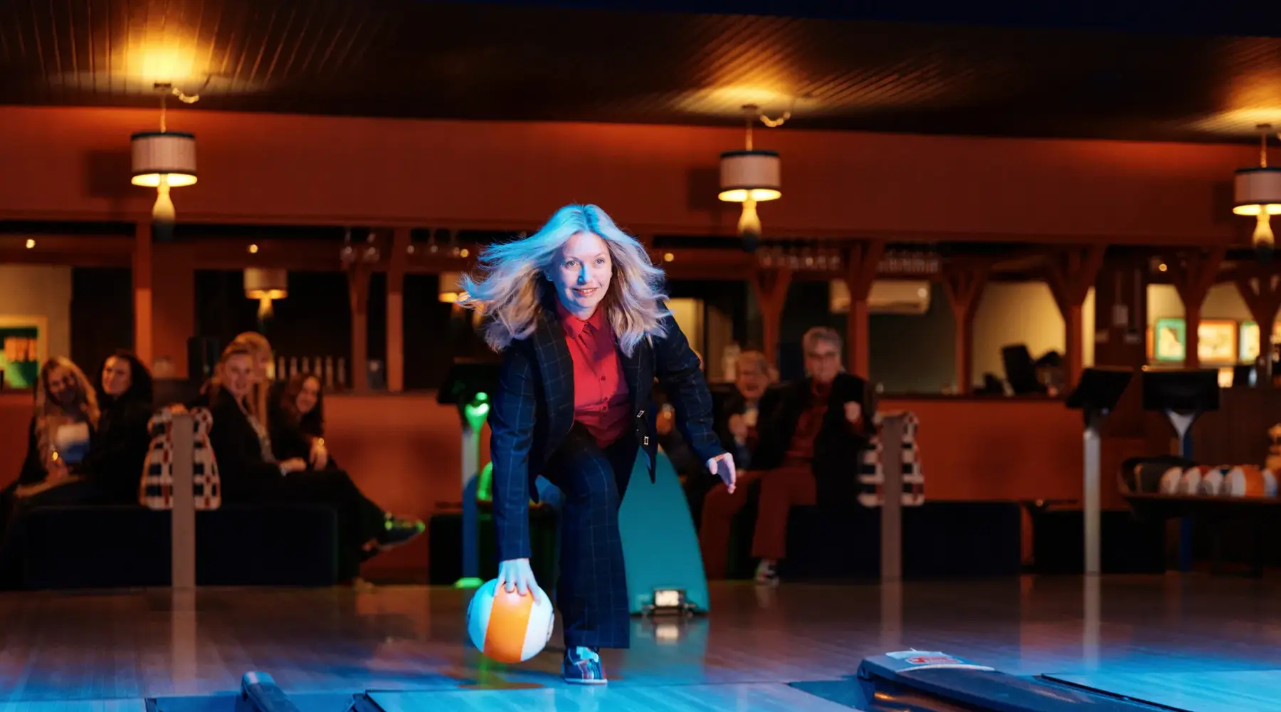 Woman bowls at the bowling alley in Drachten.