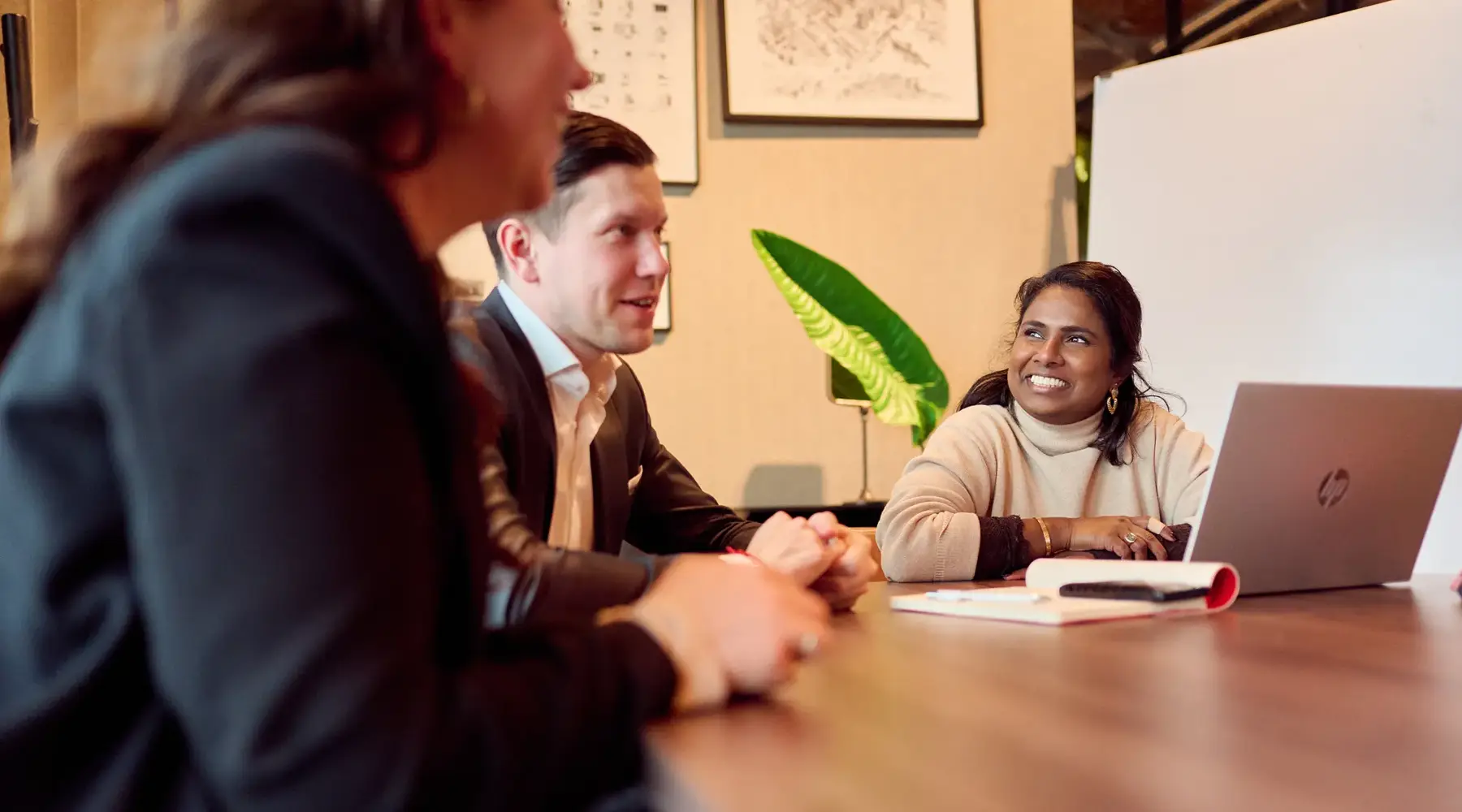 Employees of Valk Business in conversation with each other 