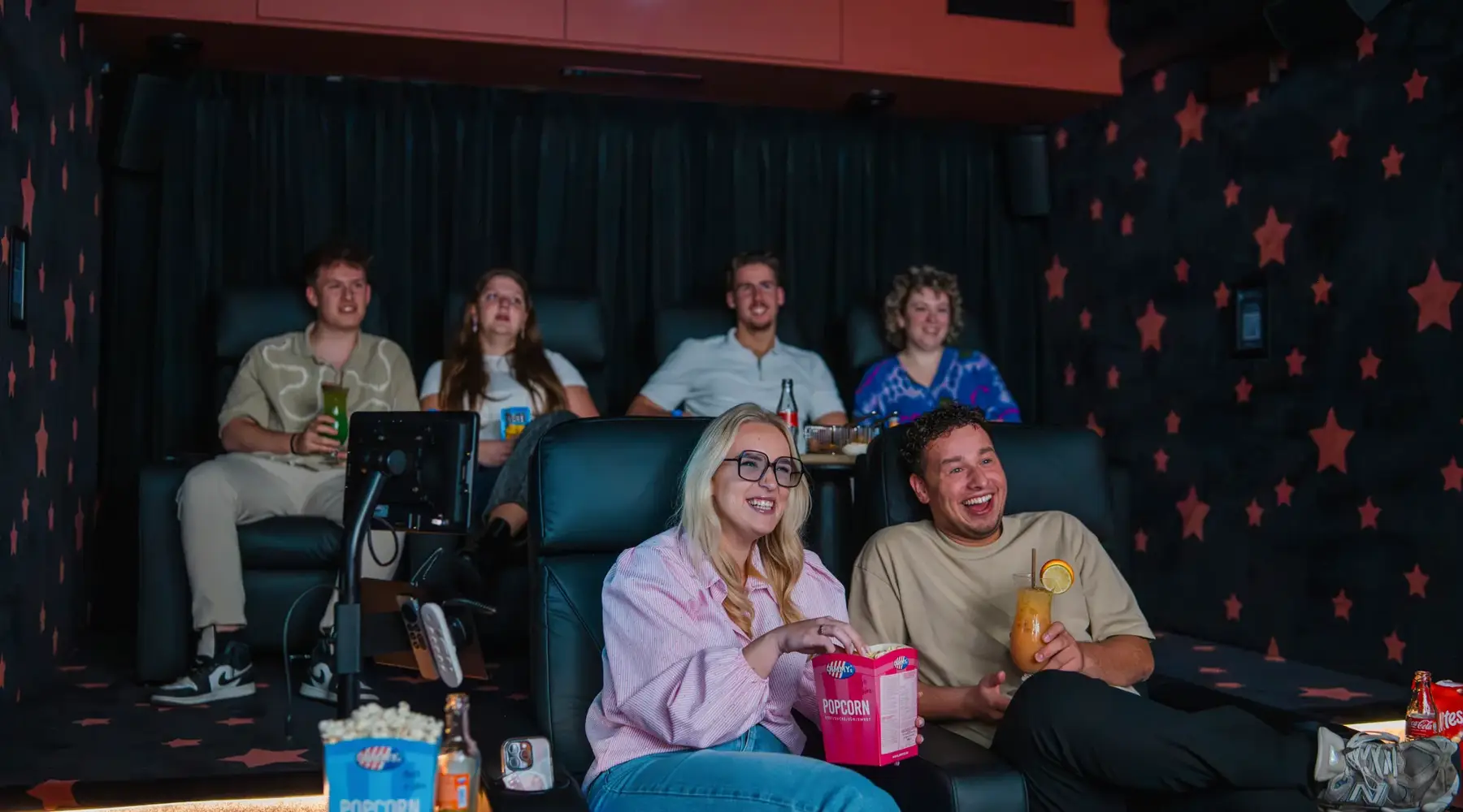 Colleagues in a private cinema.