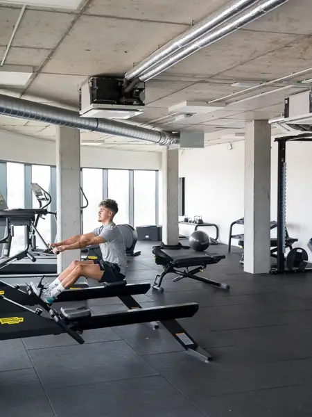 Man is exercising in the gym of Hotel Ghent