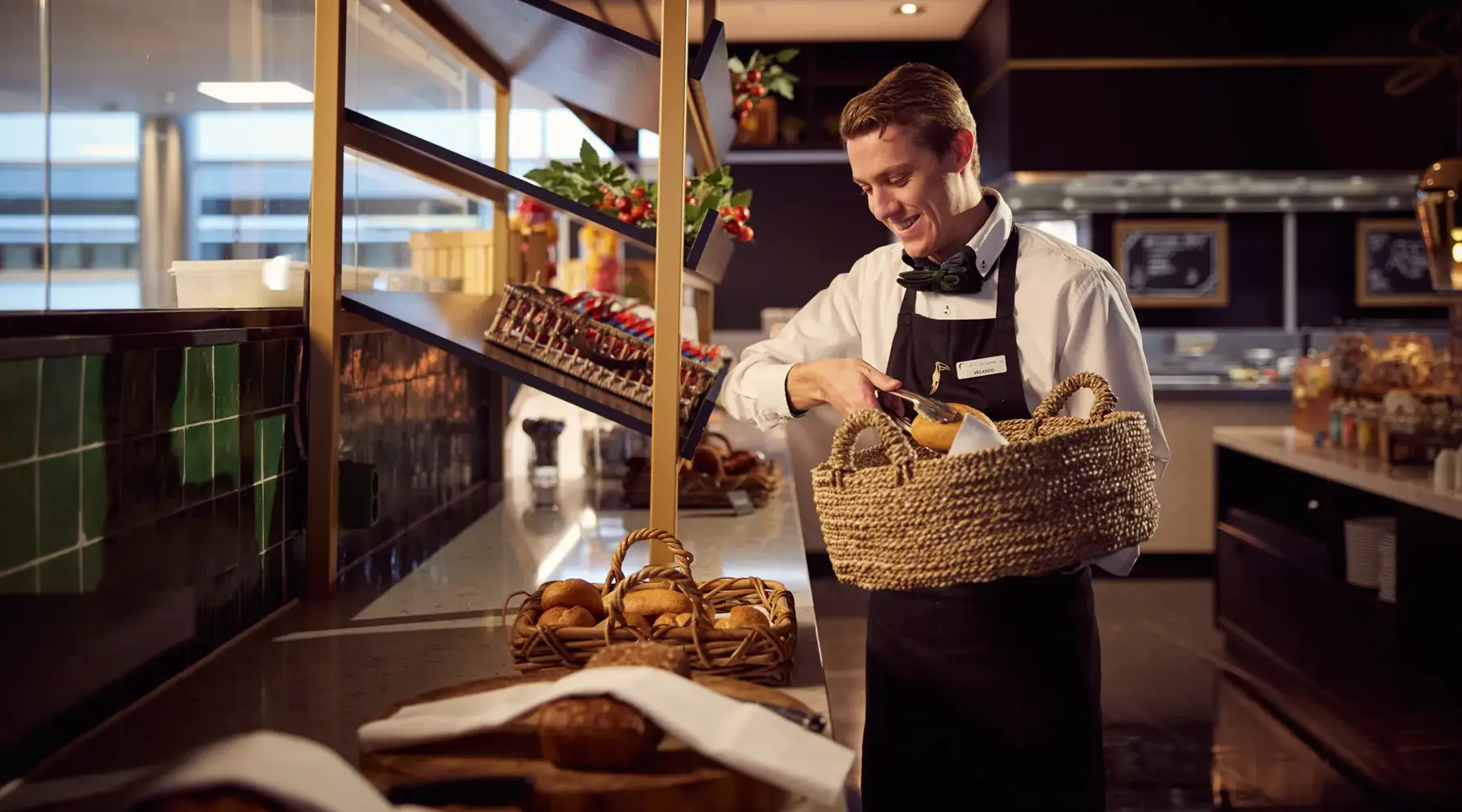 Waiter at the breakfast buffet