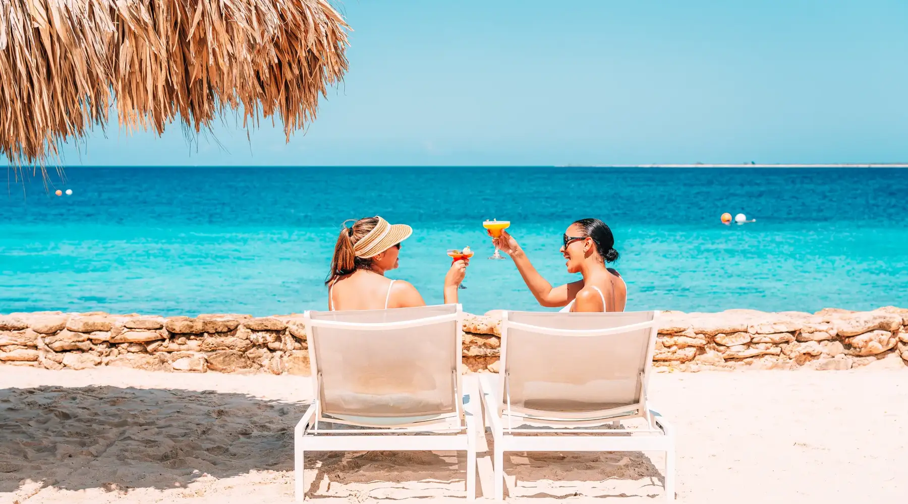 2 friends toast on the beach