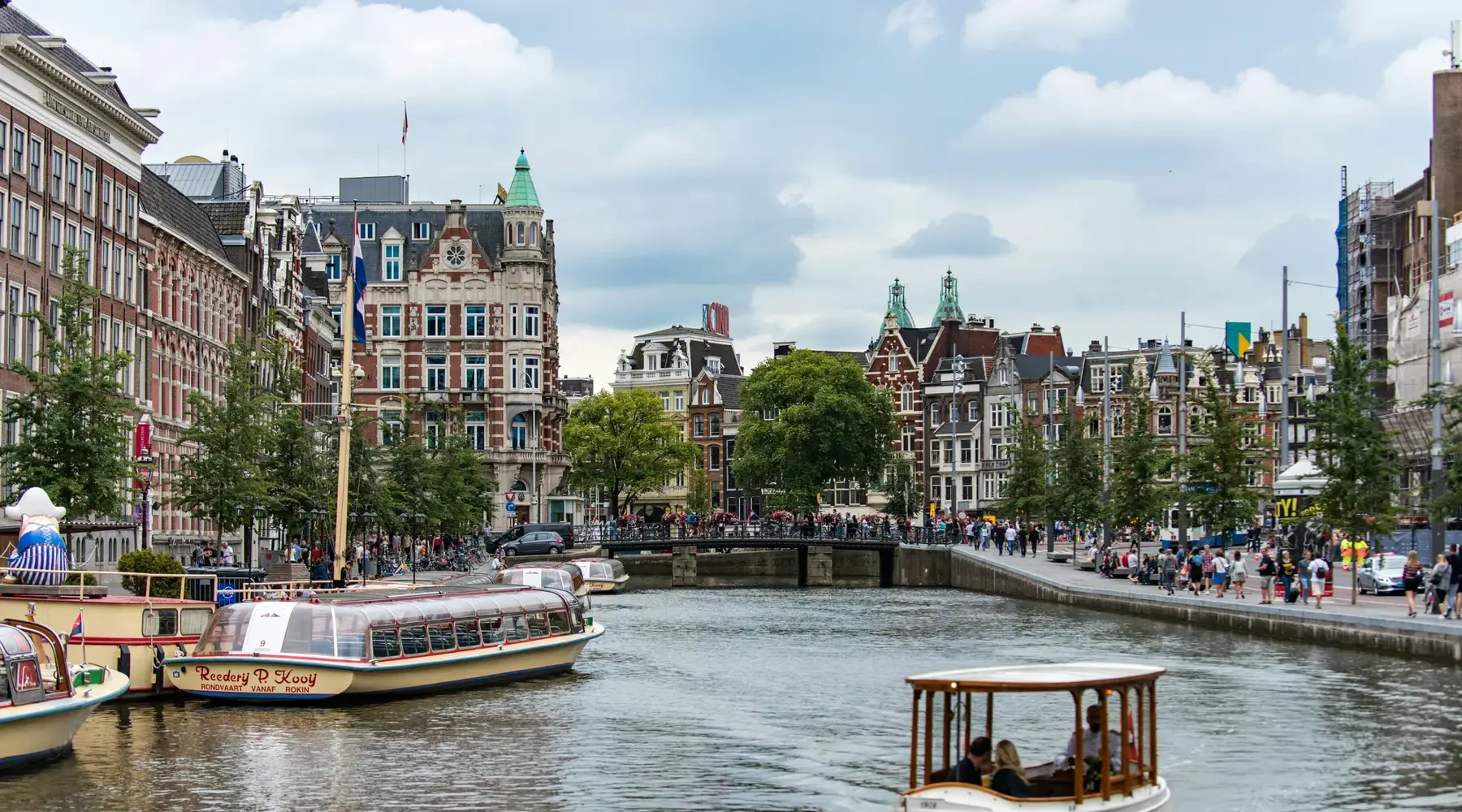 Canal with the city center of Amsterdam in the background
