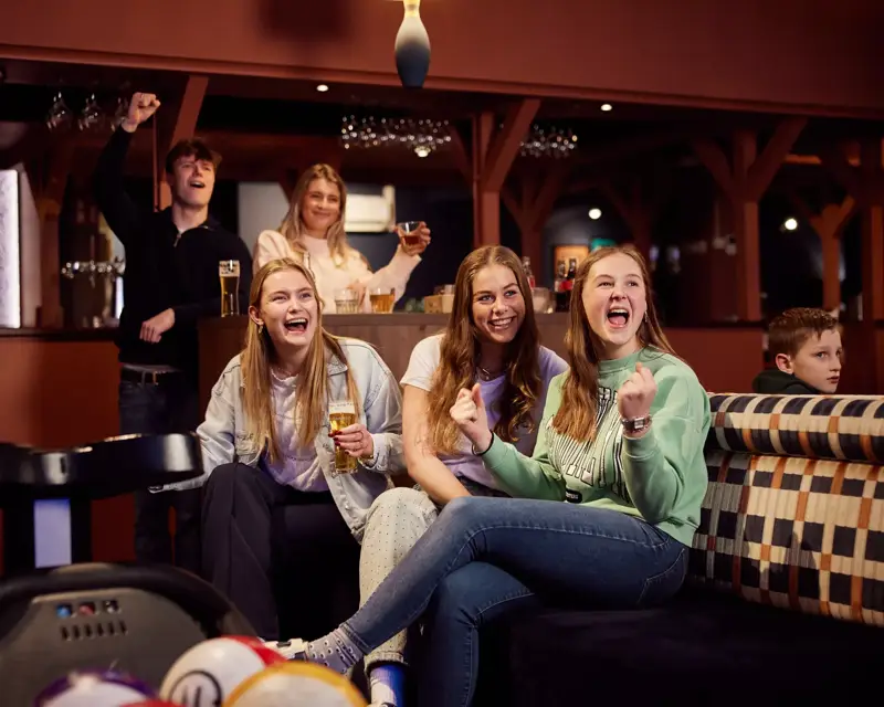 Enthusiastic friends during bowling
