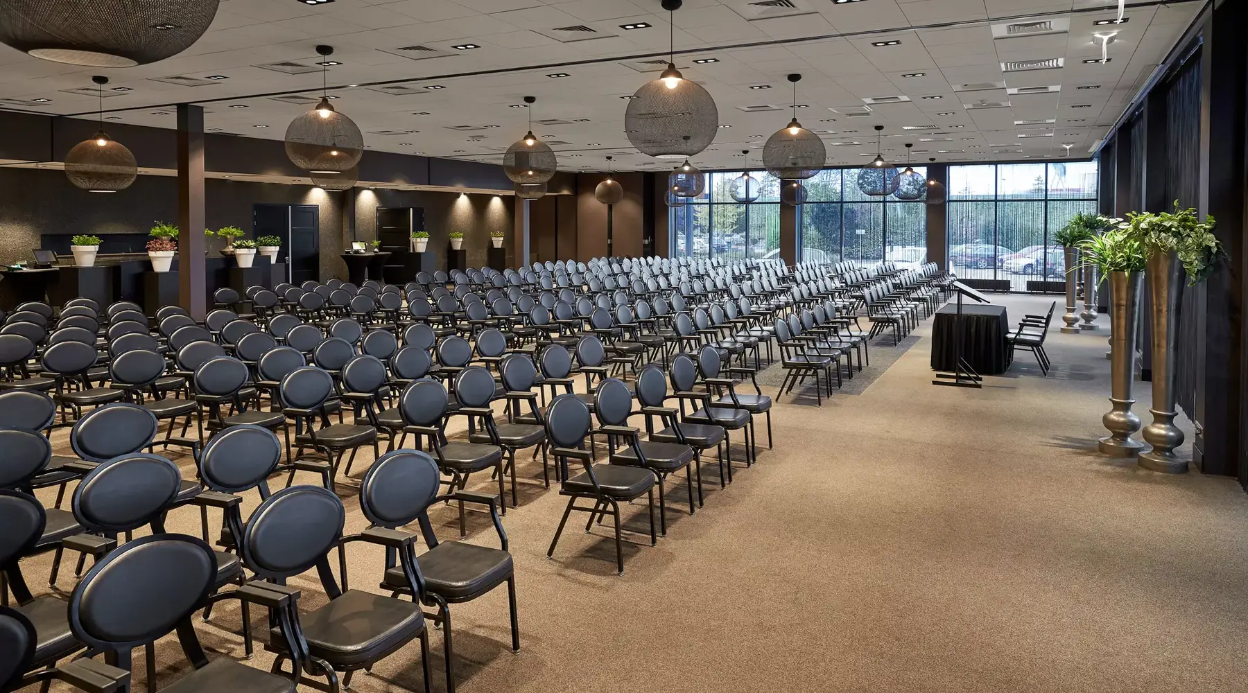Large room with many chairs suitable for a conference in Hotel Breukelen