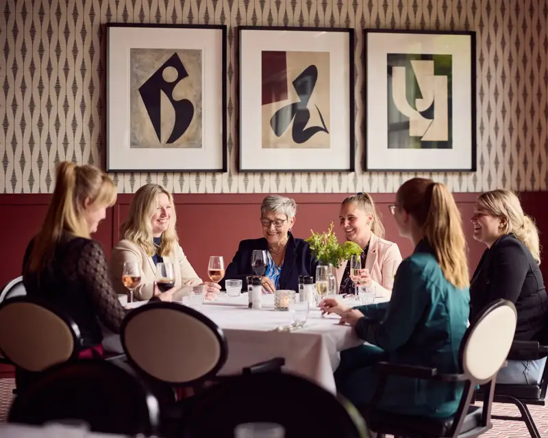 Laughing people at the table