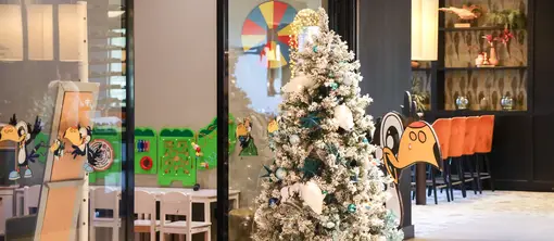 Children's corner with festive Christmas decorations and Christmas tree at Van der Valk Hotel Hoorn.