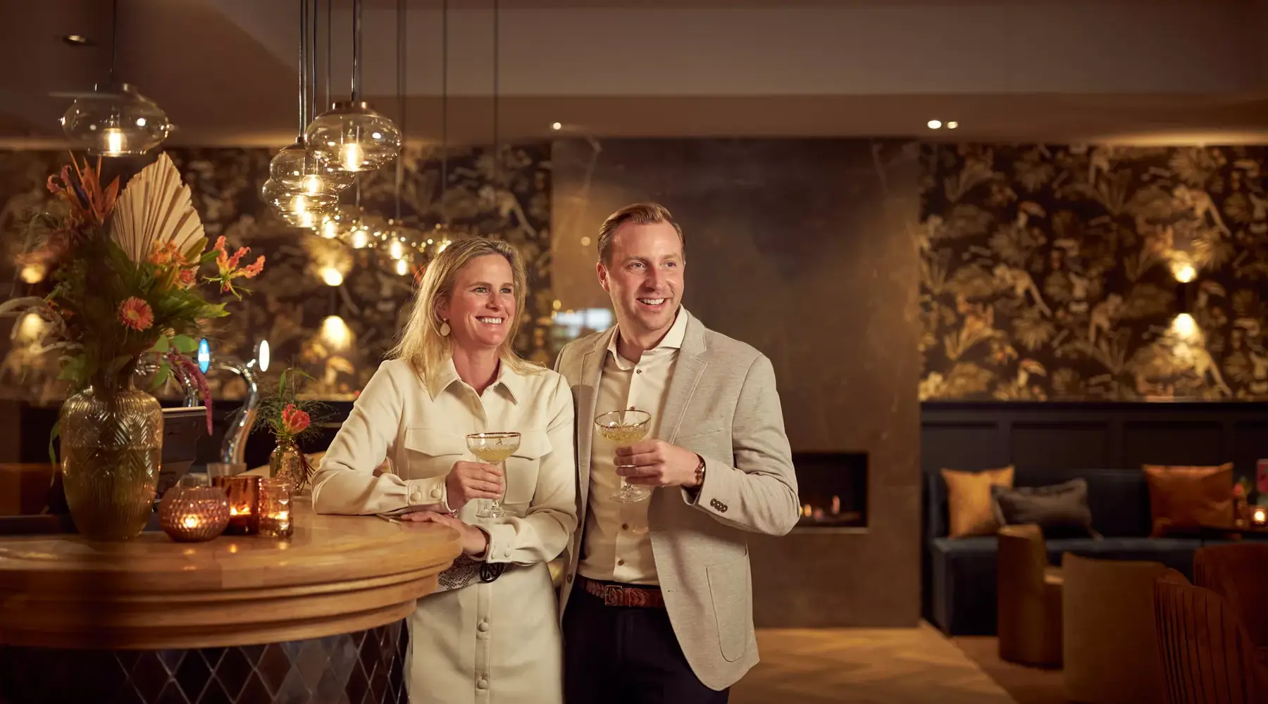 Stand by the bar with champagne.