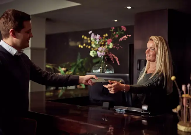 Receptionist gives card