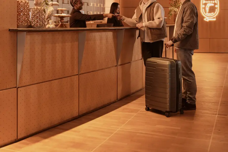 2 people at the reception of the Van der Valk Paris CDG Airport hotel
