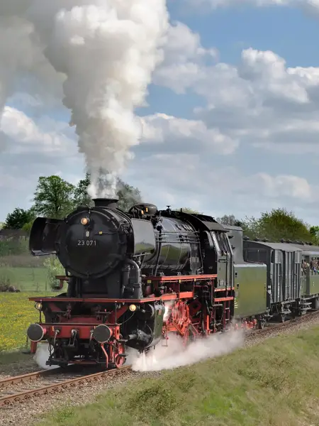 A steam train with black and red details