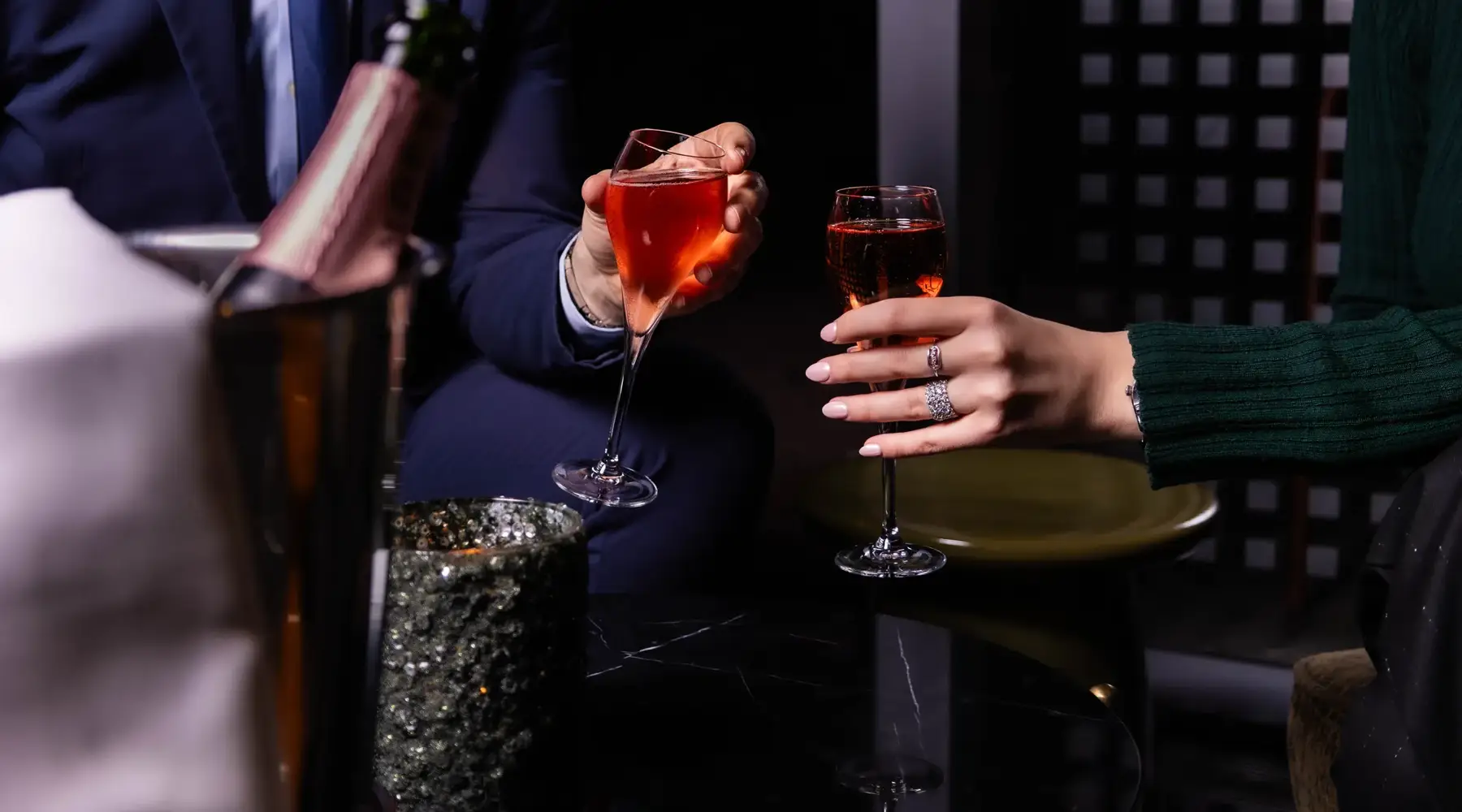 Friendly atmosphere with guests laughing and enjoying a festive dinner at the Van der Valk Hotel Paris CDG Airport.