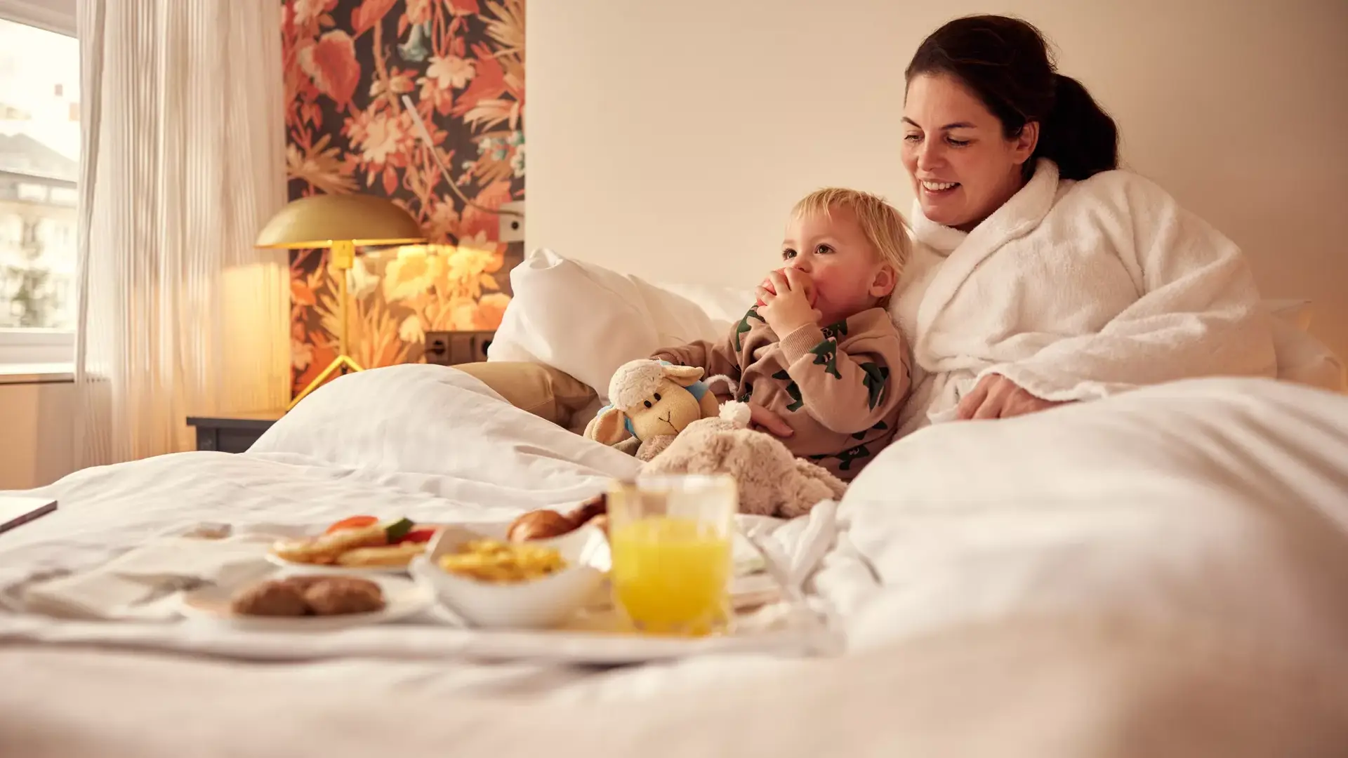 Mother with child in bed