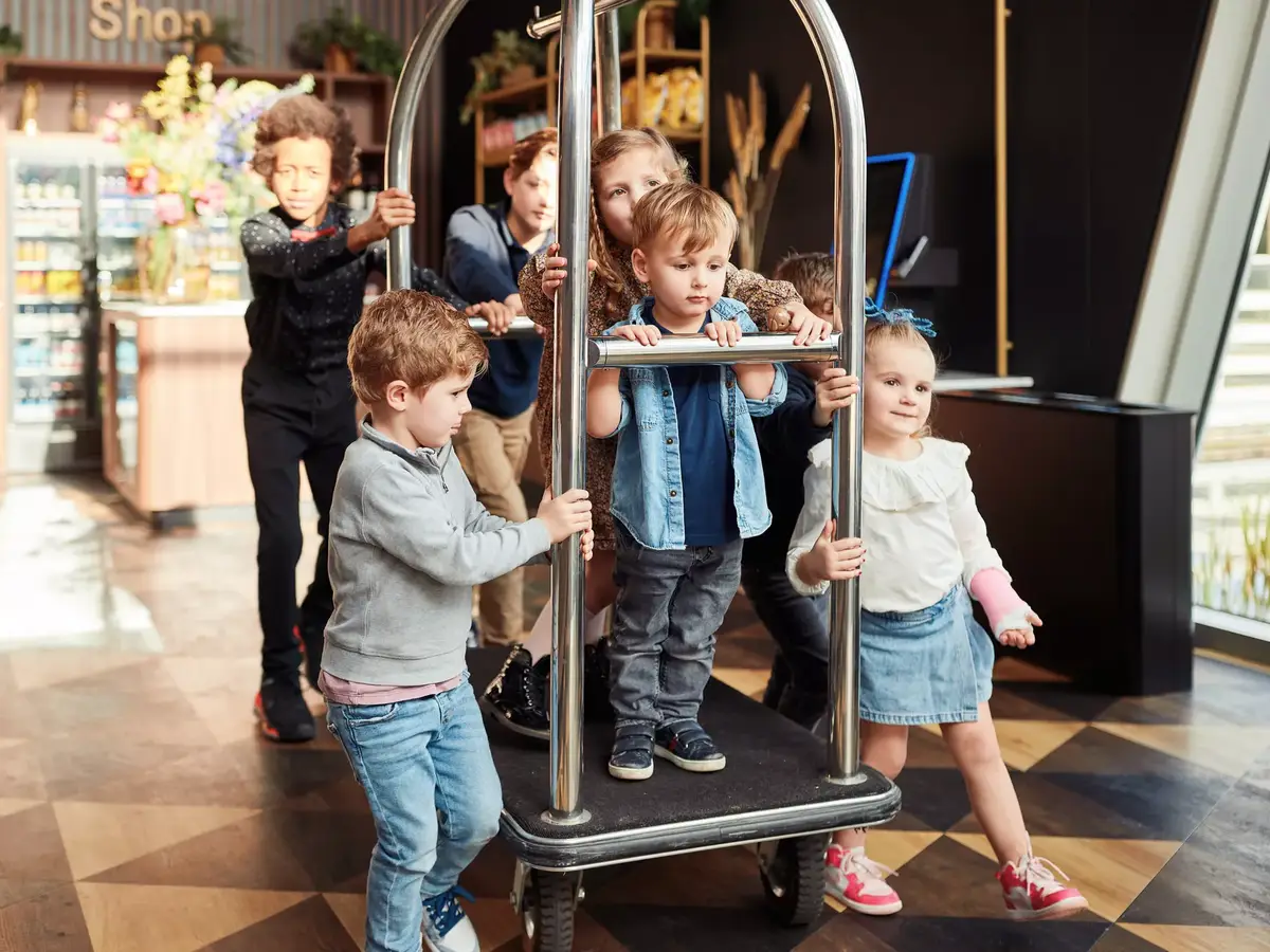 Children playing in the corridor of a hotel