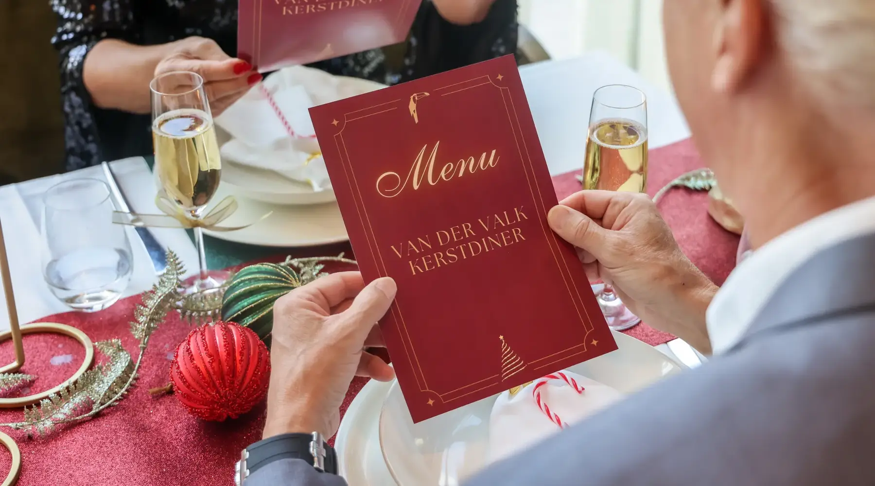 Guests view the menu during the festive Christmas Choice Dinner at Van der Valk Hotel Hoorn.