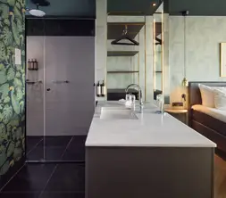 Open bathroom with sink and shower