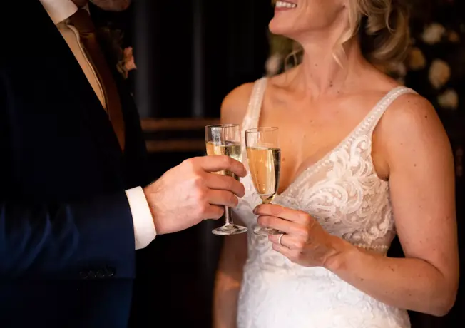 Bridal couple with a glass of Cava