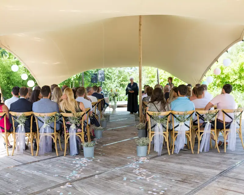 Wedding guests waiting for the bridal couple in the garden of Hotel Volendam