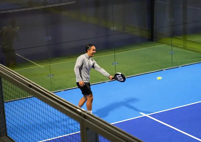 Woman on paddle court