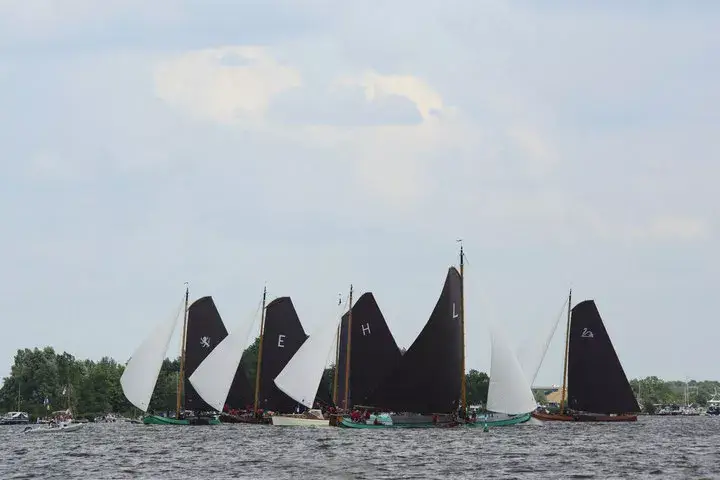 Skûtsjes sailing through the Frisian Lakes
