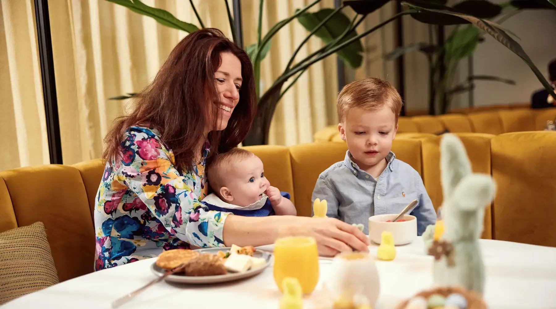 Family with wife and two young children enjoying Easter brunch