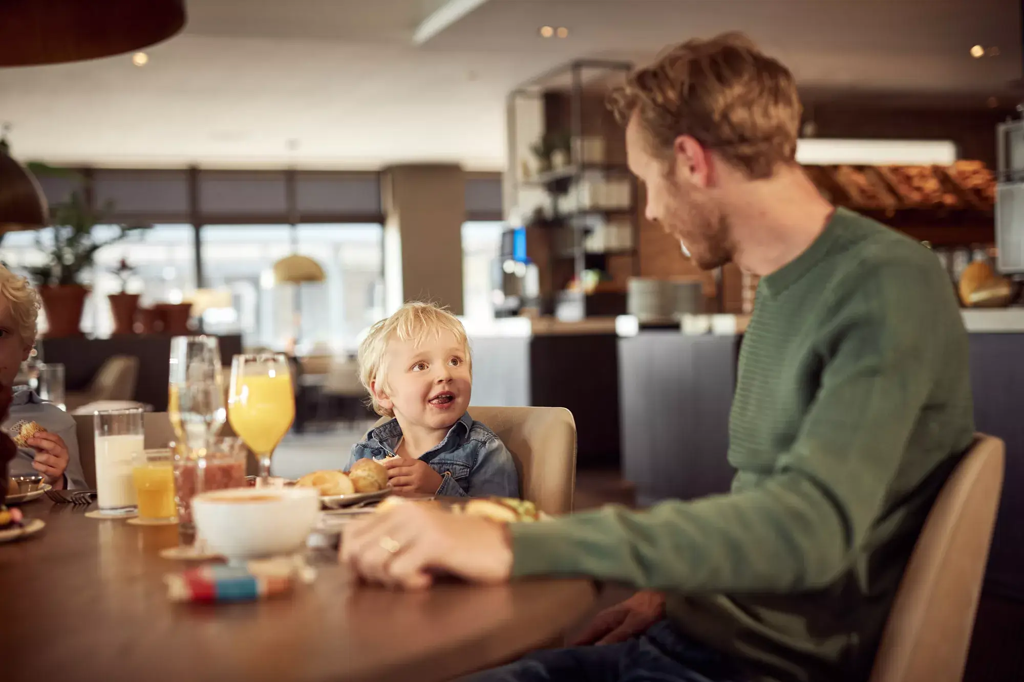 Father with child at the table